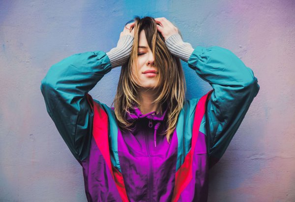 What is the best way to wear a v-neck sweater in a professional setting?